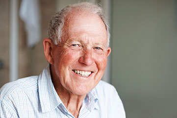 Photo of a man smiling. Link to Life Stage Gift Planner Over Age 65 Situations.